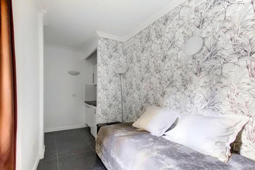 Ένα ή περισσότερα κρεβάτια σε δωμάτιο στο Bluestay 187 - Charmant studio à Paris