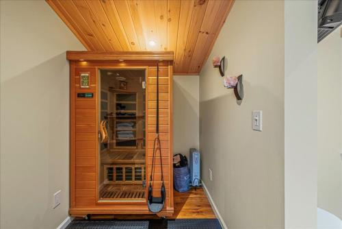 a wooden cabinet in a room with a ceiling at Pocono Scandinavian Cottage in Tobyhanna