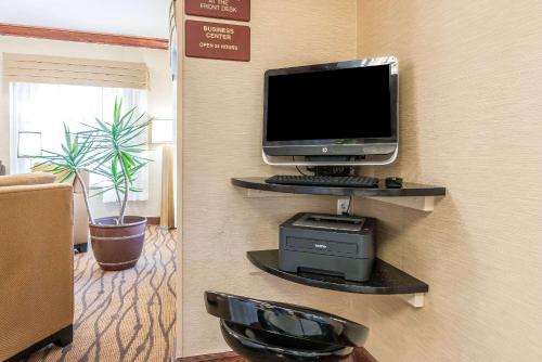 a computer monitor sitting on a shelf in a room at Sleep Inn & Suites University-Shands in Gainesville