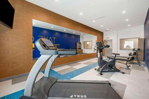 a gym with two treadmills and two exercise bikes at Comfort Suites St Augustine Historic District Area in Saint Augustine