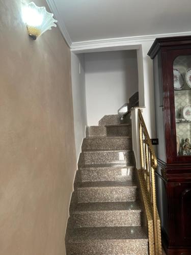 a staircase in a home with a stair case at House Nonna Nina in Celano