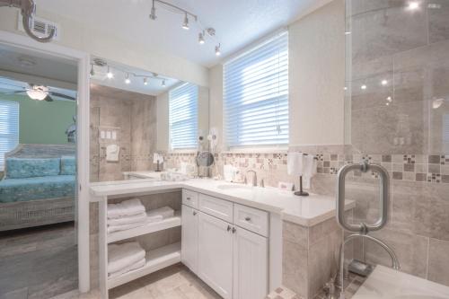 a bathroom with two sinks and a shower at Clearwater Beach Suites #105 in Clearwater Beach