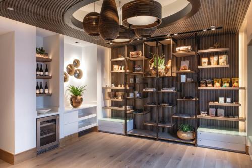 a room with shelves of vases and plants at The Bidwell Marriott Portland in Portland