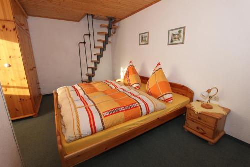 Postel nebo postele na pokoji v ubytování Ferienwohnung Inselsbergblick