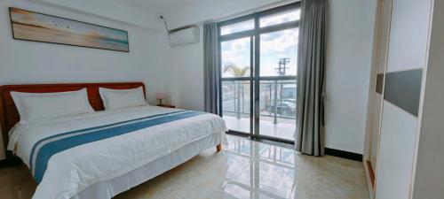 Ένα ή περισσότερα κρεβάτια σε δωμάτιο στο Ocean Breeze Apartment Hotel