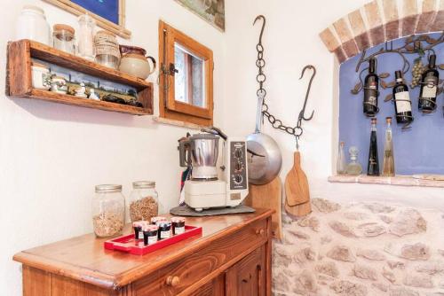a kitchen with a blender on top of a wooden cabinet at Magnifica residenza a Manciano - Terme di Saturnia in Manciano