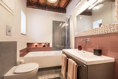 a bathroom with a tub and a toilet and a sink at Magnifica residenza a Manciano - Terme di Saturnia in Manciano