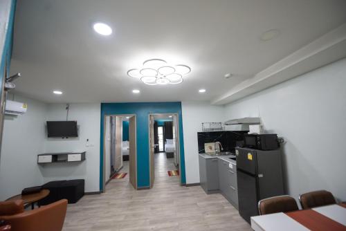 a room with a kitchen and a dining room at SkyLink Homes in Bangkok