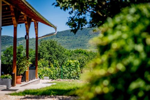 a pavilion with a view of a mountain at Orgona Vendégház Golop in Golop