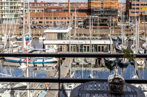 a view of a marina with boats in the water at BizStay Harbour I Scheveningen Apartments in Scheveningen
