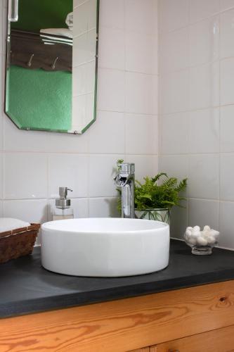 a white sink on a counter in a bathroom at Zen Den Cornwall in Boscastle