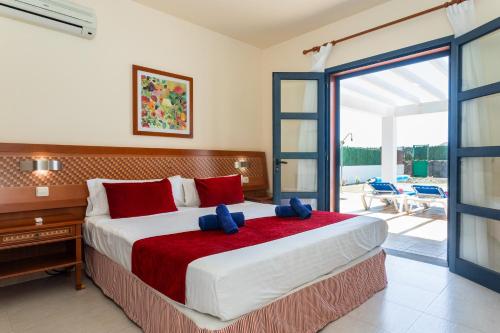 Ένα ή περισσότερα κρεβάτια σε δωμάτιο στο Villas Susaeta