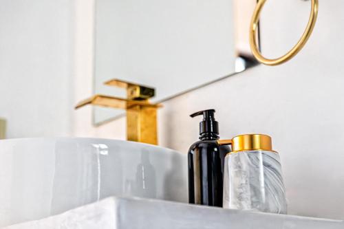 a bottle of soap sitting on top of a sink at Casa Palma in La Paz
