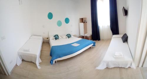 a bedroom with a bed and two tables at Nonno Pippi in Lido Conchiglie