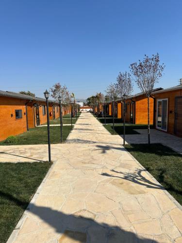 a walkway in front of a group of buildings at Some Hotel Antakya in Hatay