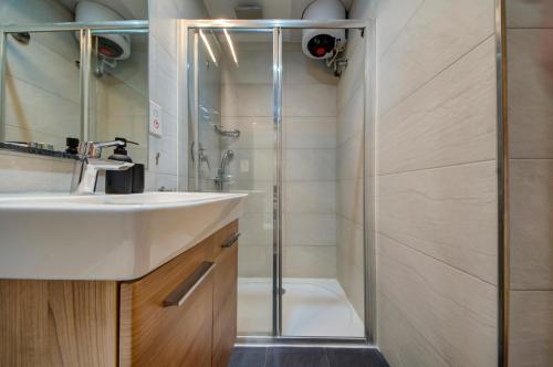 a bathroom with a sink and a shower at Mosta Central City Residences by 360 Estates in Mosta