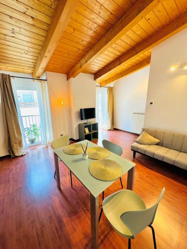 a living room with a table and chairs at Crops City Stay Apartment 14 in Trieste