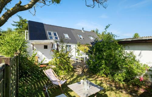a view of a house with a solar roof at Lovely Home In Hasle With Wifi in Hasle