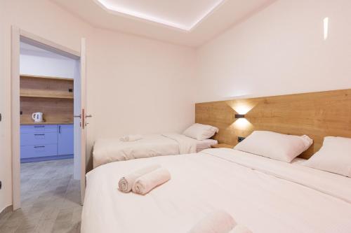 Ένα ή περισσότερα κρεβάτια σε δωμάτιο στο Apartments River