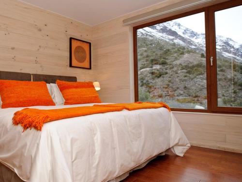 מיטה או מיטות בחדר ב-NOI Puma Lodge