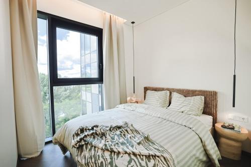 Ένα ή περισσότερα κρεβάτια σε δωμάτιο στο River home