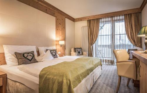 Postel nebo postele na pokoji v ubytování Taubers Unterwirt Aktiv & Vitalhotel