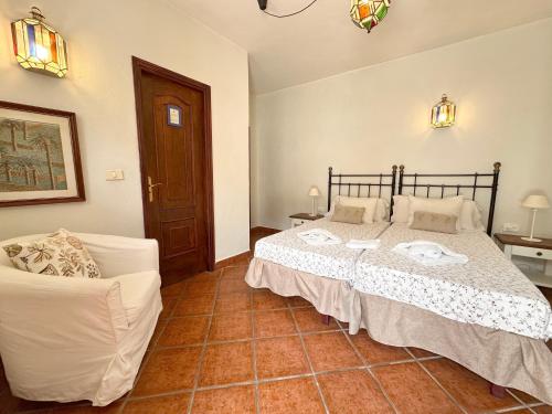 Katil atau katil-katil dalam bilik di Casa El Patio