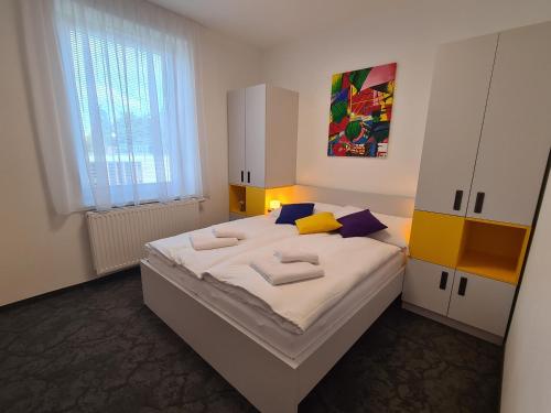 Ένα ή περισσότερα κρεβάτια σε δωμάτιο στο Apartmány Nikola