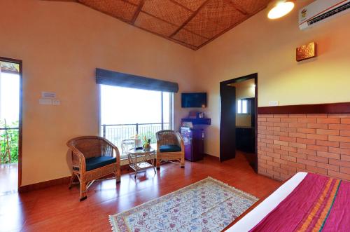 Posezení v ubytování The Estate Resort , Mangalore