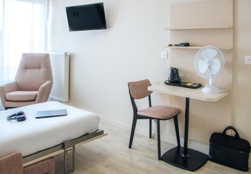 Μια τηλεόραση ή/και κέντρο ψυχαγωγίας στο Twenty Business Flats Lille - Bayard