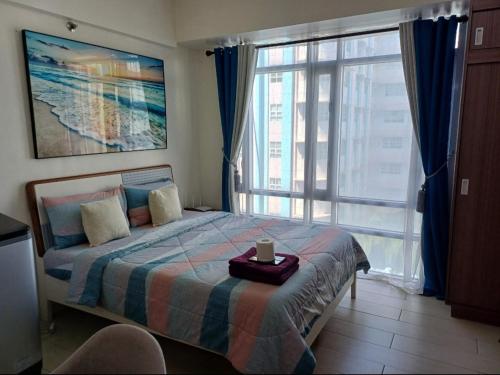 Postel nebo postele na pokoji v ubytování Pasay Staycation with Parking Space in 150 Newport Boulevard near Resort World & NAIA T3