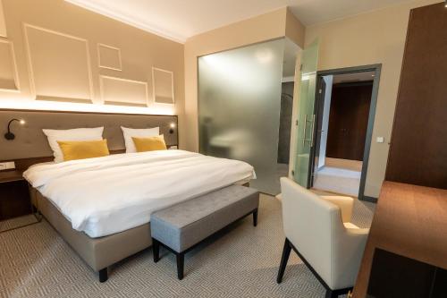 Parkhotel Kurhausにあるベッド