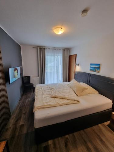 Postel nebo postele na pokoji v ubytování Hotel Kurhaus Uhlenberg