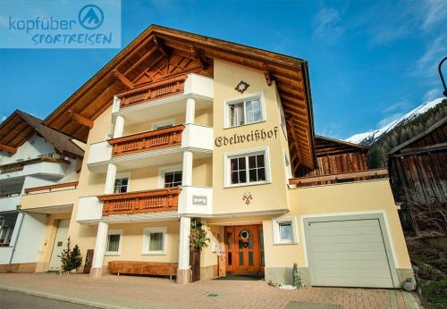 a house with a wooden roof at Edelweißhof in Ischgl
