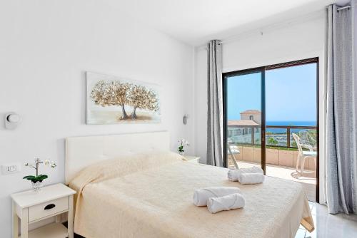 Ένα ή περισσότερα κρεβάτια σε δωμάτιο στο Atlantic Penthouse Retreat