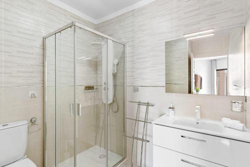a bathroom with a shower and a toilet and a sink at Atlantic Sky Panorama in Costa Del Silencio