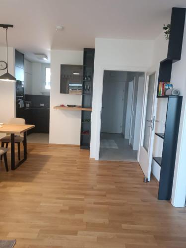 a kitchen and dining room with a table and a dining table at Brunnenpark Ruhepol in Bad Radkersburg
