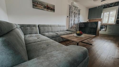 a living room with a couch and a table at Sea Level in Kotor