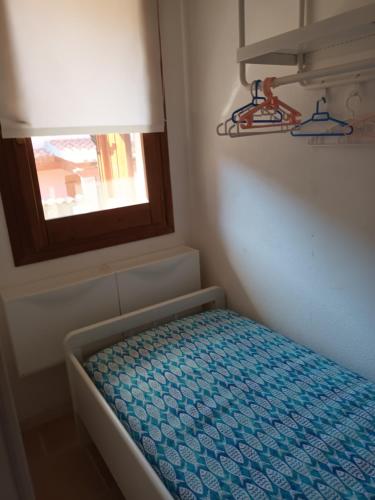 Ένα ή περισσότερα κρεβάτια σε δωμάτιο στο Casetta Anna y nietos