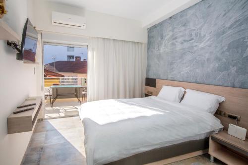 Ένα ή περισσότερα κρεβάτια σε δωμάτιο στο Old Town Apartment 2