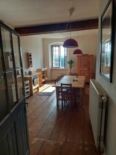 a kitchen and dining room with a table and chairs at Cool Flat at Renaissance Castle - 3BR in Ilz