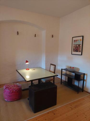 a living room with a table and a chair at Cool Flat at Renaissance Castle - 3BR in Ilz