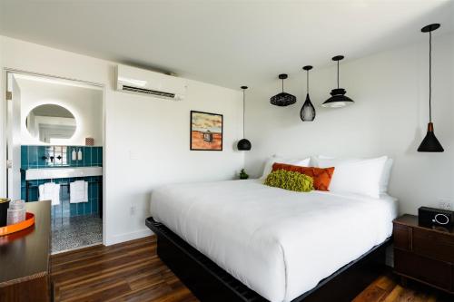 a bedroom with a large white bed in a room at The Nevada in York