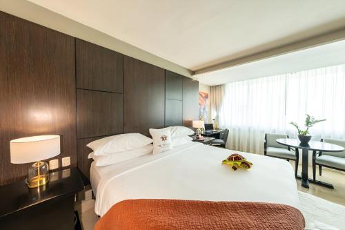 a hotel room with a bed with a toy car on it at Hotel El Panama by Faranda Grand, a member of Radisson Individuals in Panama City