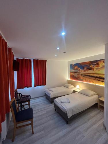 Postel nebo postele na pokoji v ubytování Stilo Hotel