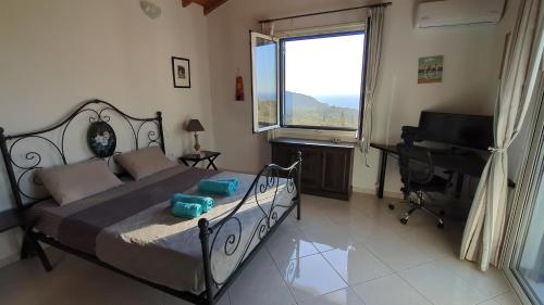 a bedroom with a bed and a desk and a piano at Villa Luna Home in Vourliótai