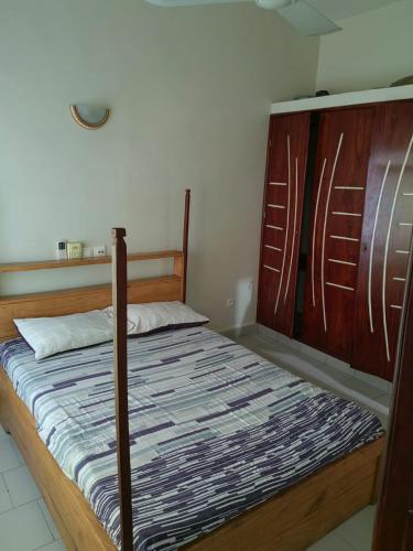 Llit o llits en una habitació de Ouslane Appart-2