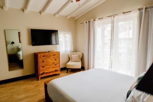 Télévision ou salle de divertissement dans l'établissement La Concordia - Boutique Hotel
