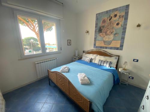 En eller flere senge i et værelse på Gioia con vista SoleMare