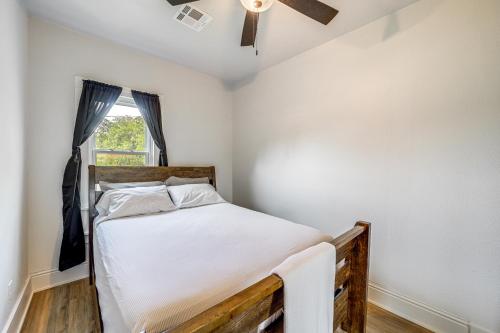 a bedroom with a bed and a window at McAlester Home with Large Yard and Grill! in McAlester